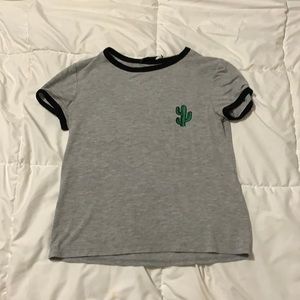 Grey soft tee with little cactus over heart